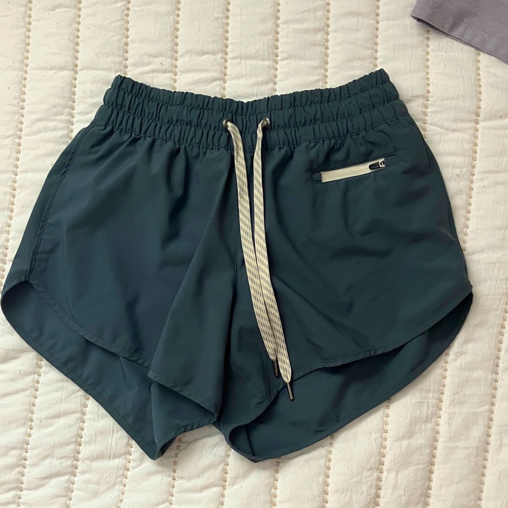 Vuori Women's Athletic Shorts in Deep Teal with Cream Drawstring